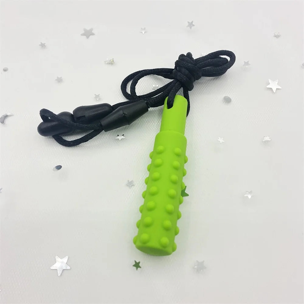 Green silicone teething toy on a black lanyard for baby teething relief.