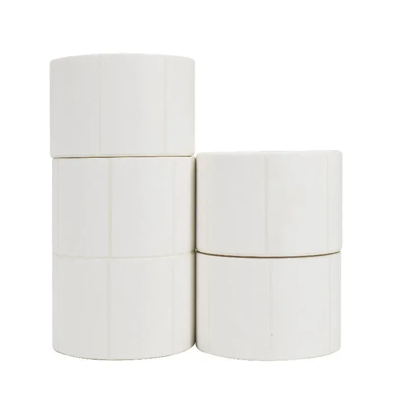 Two white blank label rolls stacked side by side, showing smooth label tape.