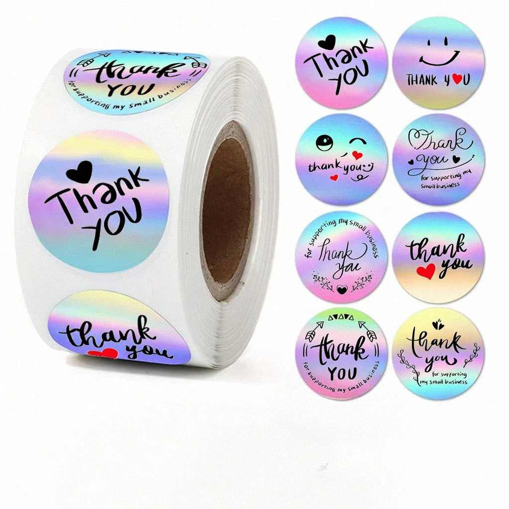Round holographic thank-you sticker labels on a roll with matching loose labels