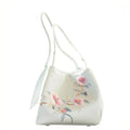 Lightweight white satin women's trunk purse featuring elegant floral Suzhou embroidery and dual shoulder straps.