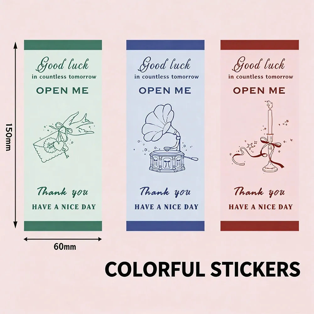 Colorful rectangle seal stickers with “Good luck” and “OPEN ME” on three designs