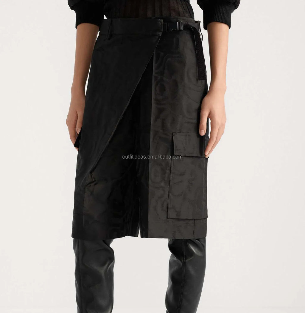 Black luxury silk wrap skirt with tonal jacquard logo pattern, utility pockets, and buckle belt detail.