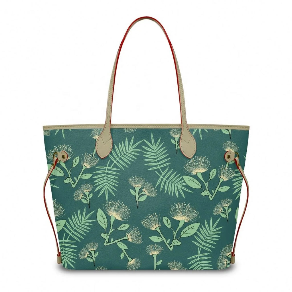 Designer leather tote bag with teal Ohia Lehua floral print, tan leather straps, and red trim accents.