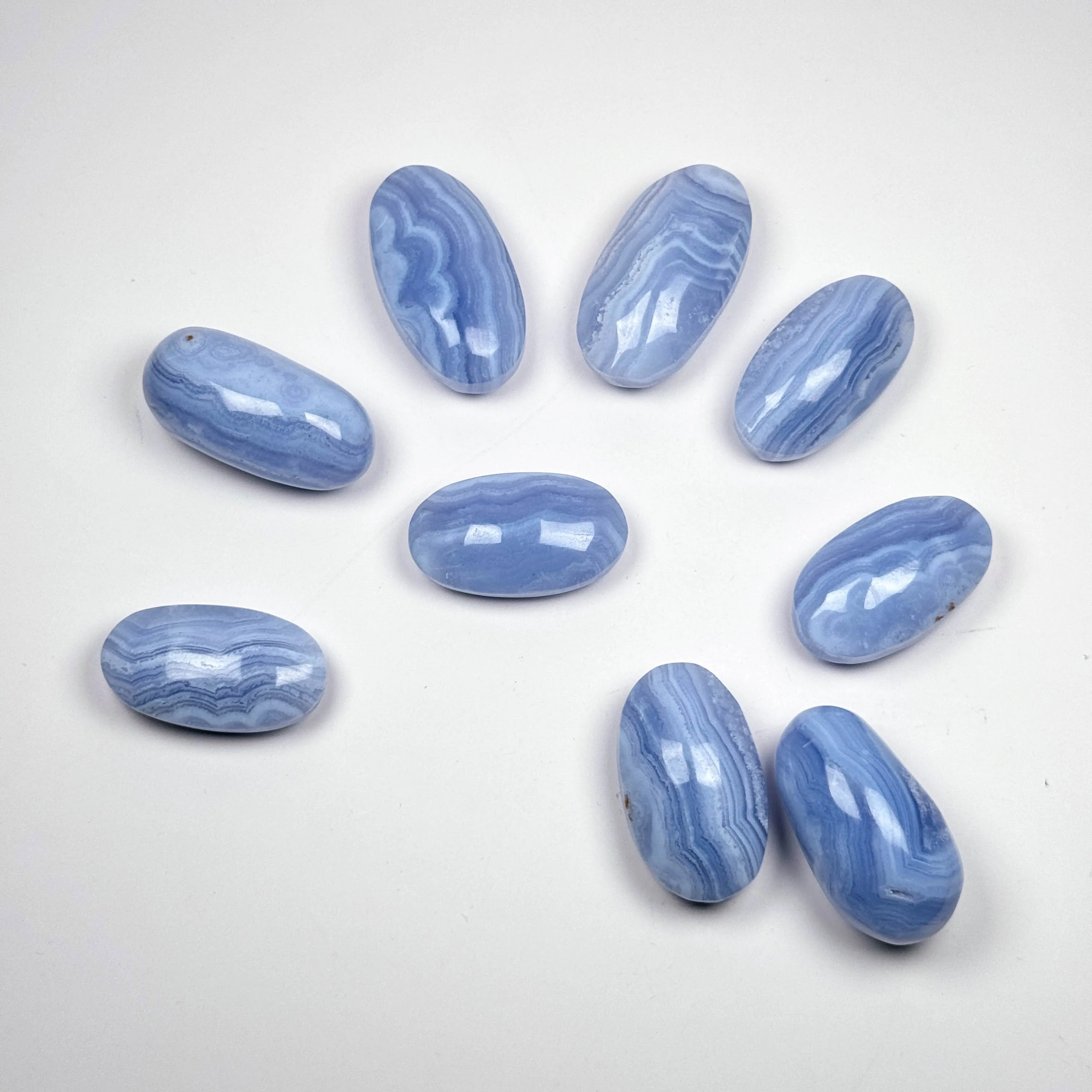 Blue lace agate palm stones, oval tumbled gemstones with blue wavy banding