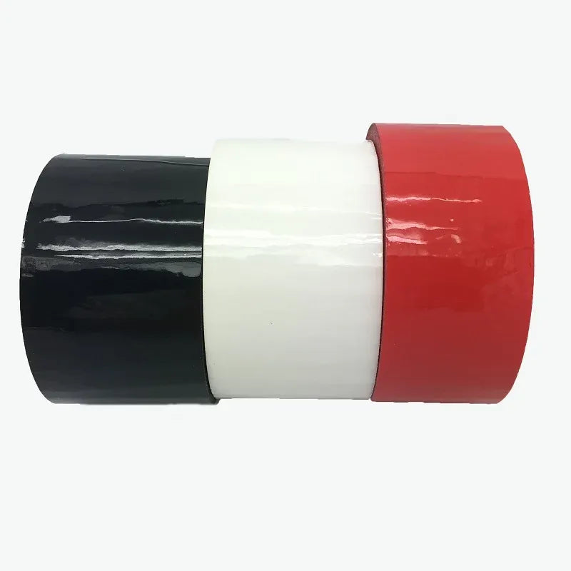 Colored acrylic carton sealing tape roll with black, white, and red layers