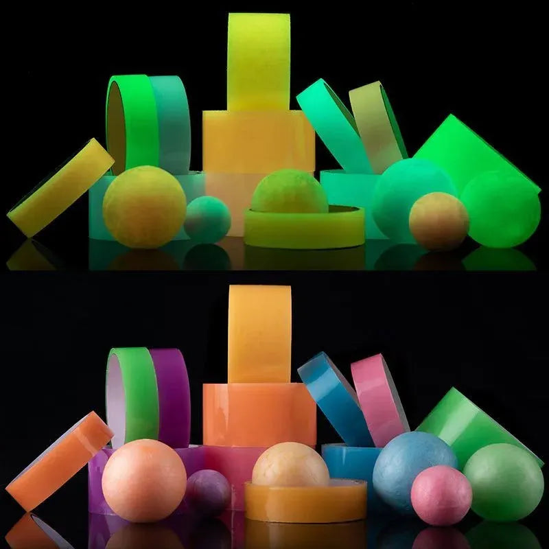 Assorted neon glow tape pieces, discs, and glowing balls in green, yellow, orange, and pink