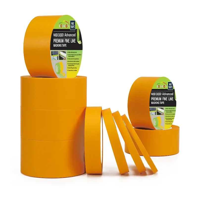 Yellow masking tape jumbo rolls with green label and hanging tape strips