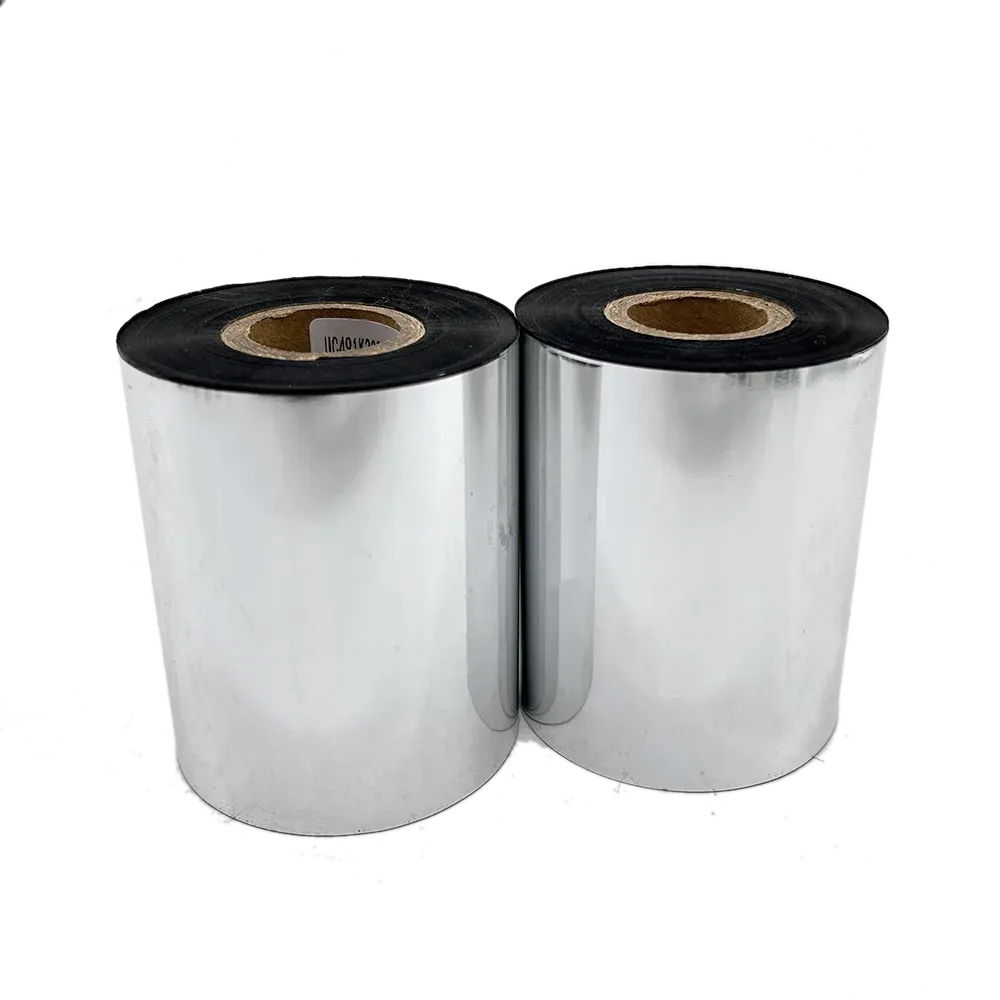 Two silver vinyl sticker rolls with black inner cores and center label