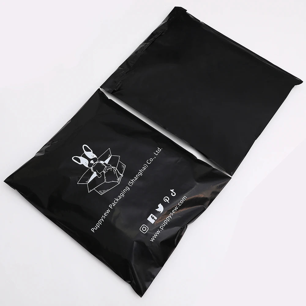 Black poly mailer shipping bags stacked, featuring bunny logo and website text