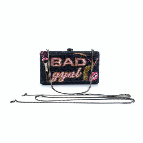Black crystal-embellished "BAD gyal" rhinestone clutch purse with makeup motifs and detachable chain shoulder strap.