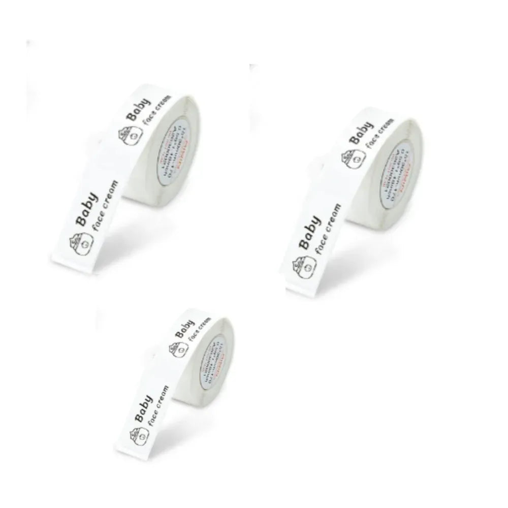 Set of small white baby label stickers with icons and printed text