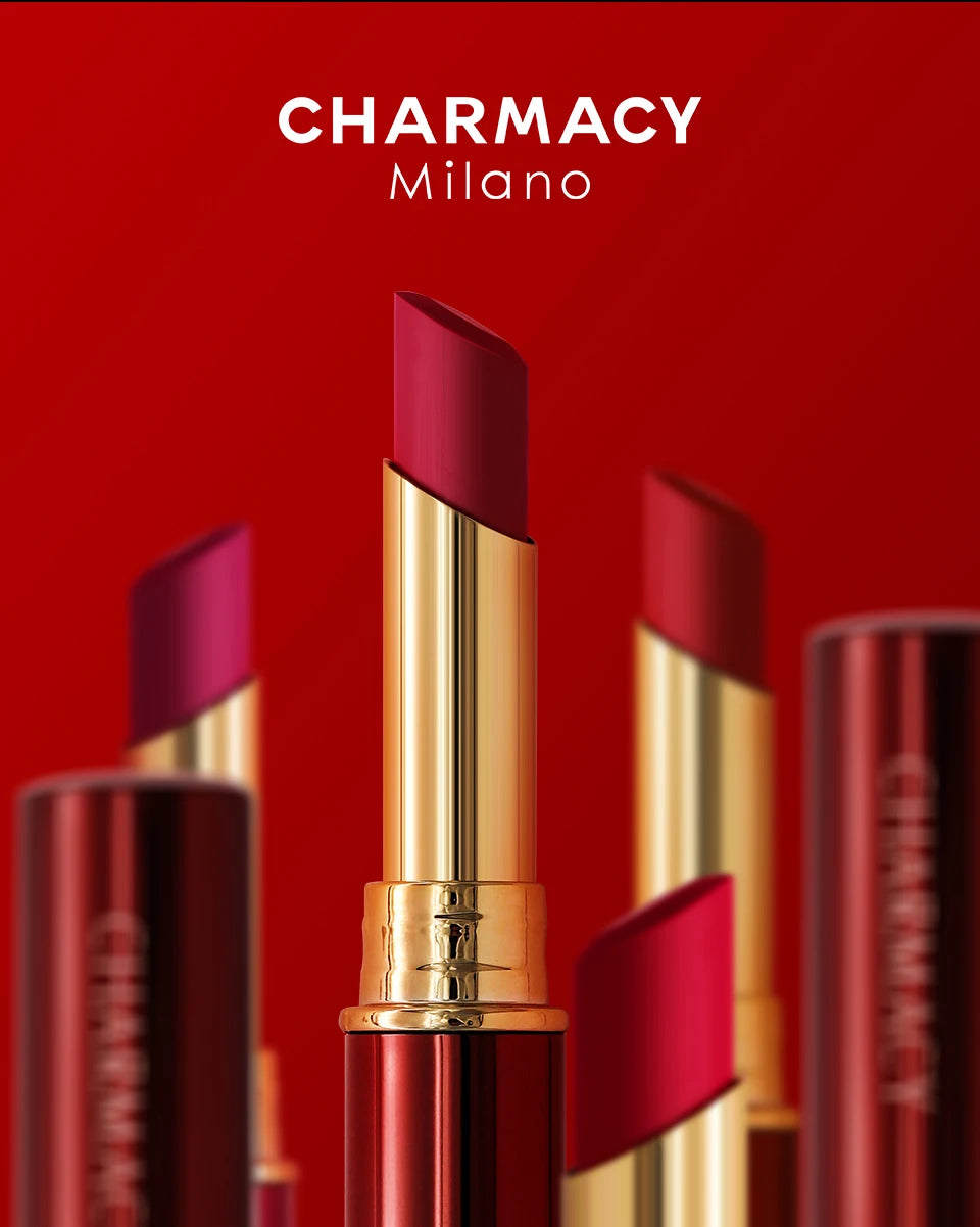 Charmacy long-lasting matte velvet lipstick in gold casing with vibrant red lipstick shades against a red background.