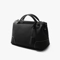 Black top-grain cowhide leather designer handbag with contrast stitching and silver-tone hardware details.