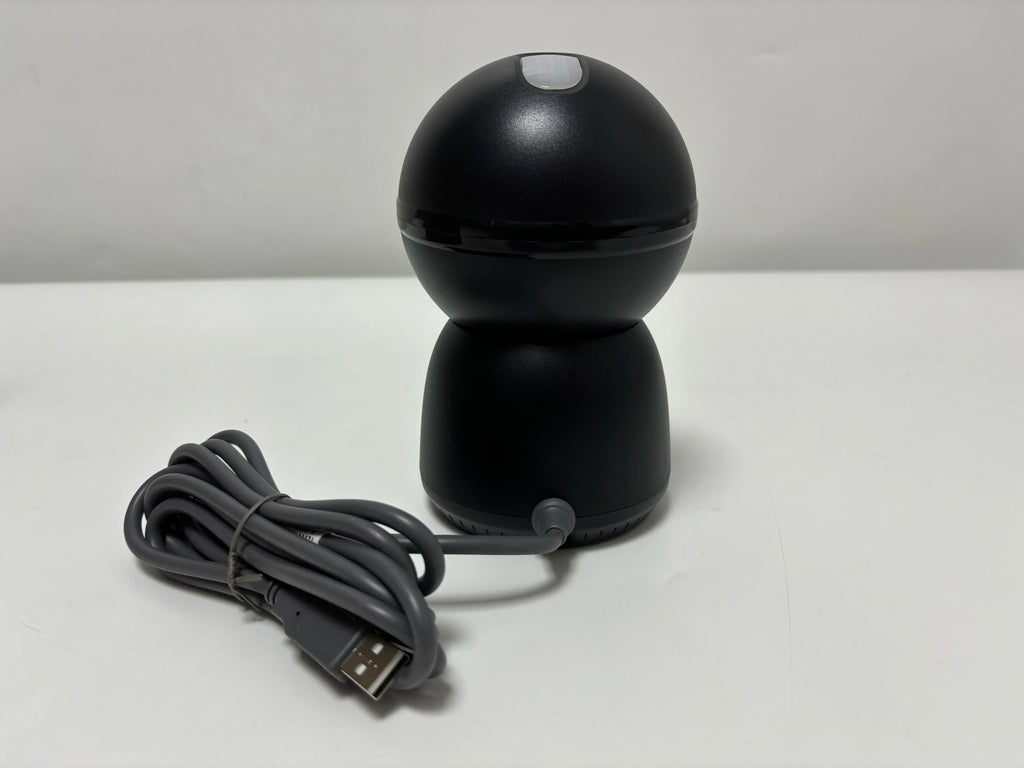 Black desktop barcode scanner with rounded head and attached USB cable