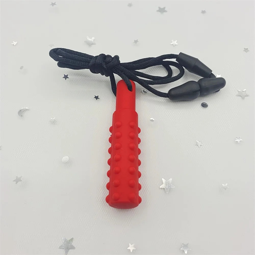 Red silicone baby teething toy with textured sensory surface and black safety lanyard.
