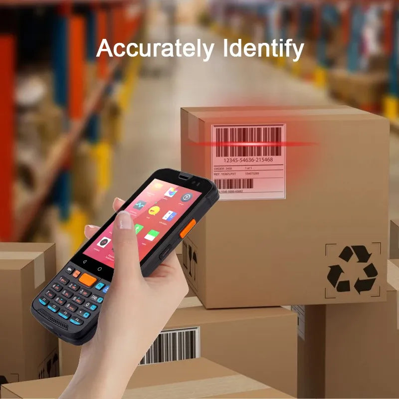 Black rugged PDA handheld scanning barcode labels on cardboard boxes