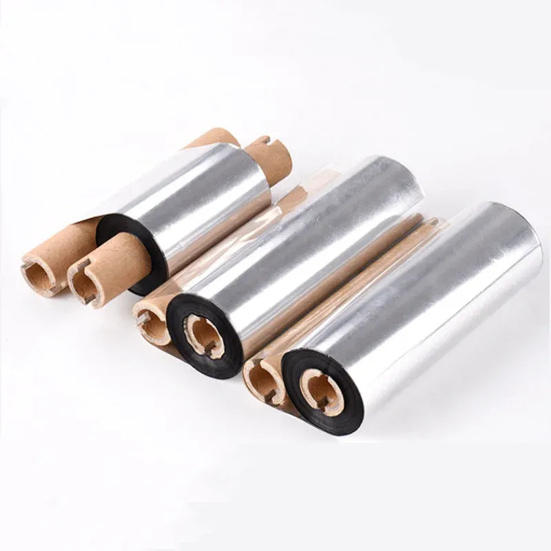 Silver thermal transfer ribbon rolls with black hubs and exposed cardboard cores