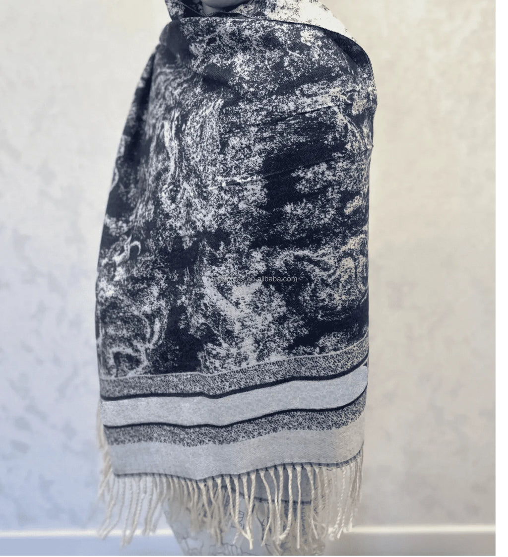 Large black and white marble print silk scarf with striped border, fringe trim, and luxurious rectangular design.