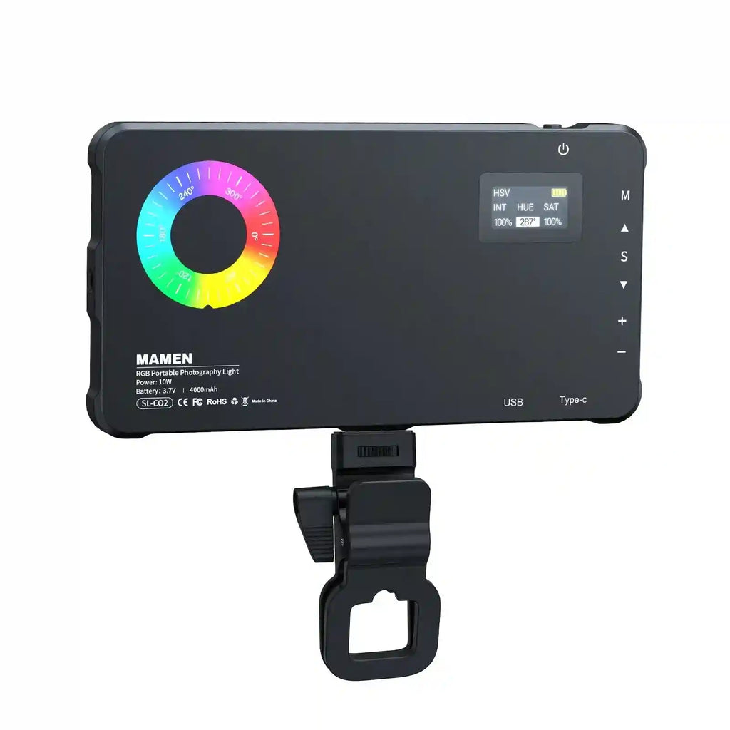 Black rectangular RGB LED video light with a circular color wheel display, digital settings screen, and mount clip.