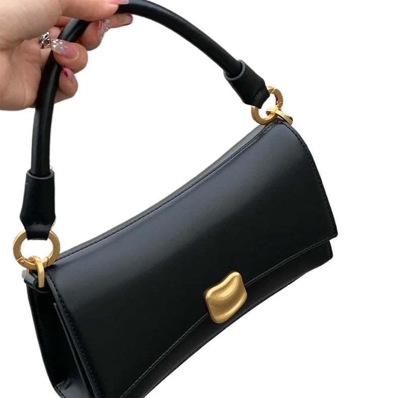 Black square designer underarm handbag with gold magnetic clasp and smooth PU leather finish.