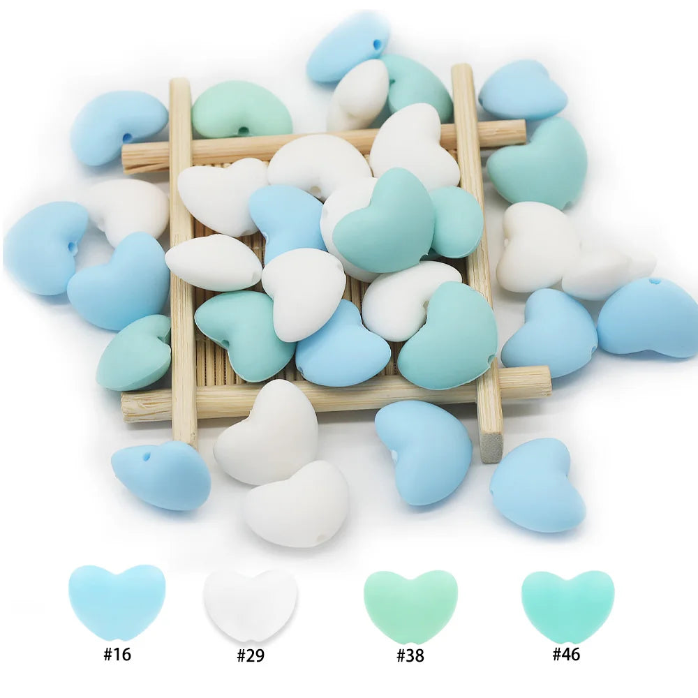 Blue and white heart silicone teething beads for baby teething toy DIY projects.