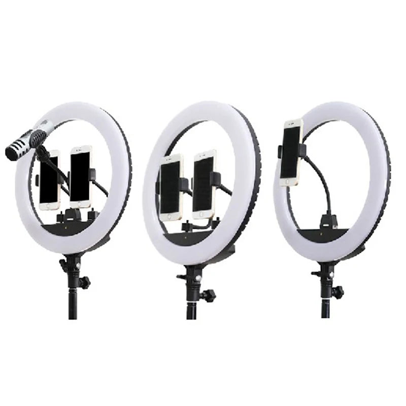 Circular LED ring light on a stand with adjustable mounts for smartphones and a microphone for recording or streaming.