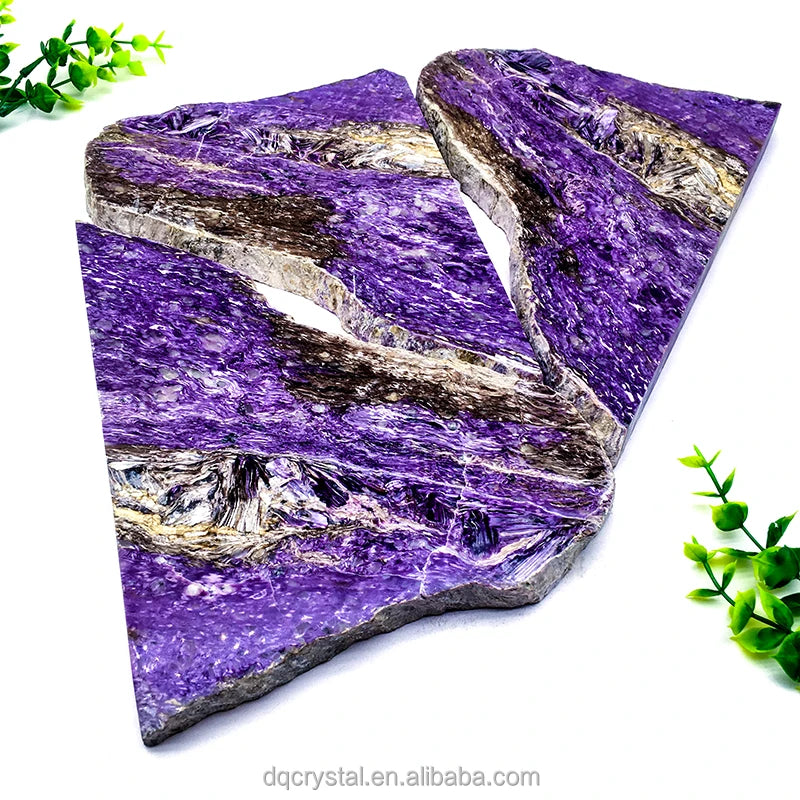 Polished purple charoite slice stone, irregular layered cut with striations