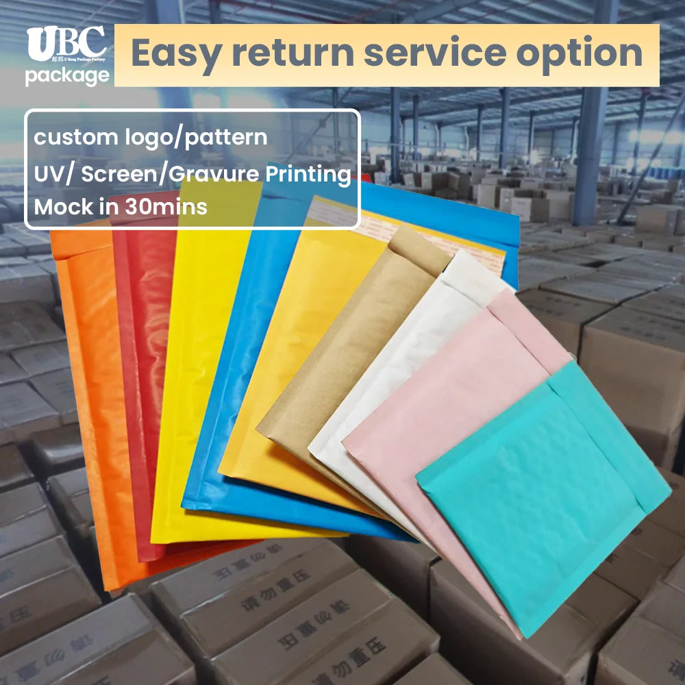 Assorted colorful paper padded envelopes, stacked on a pallet in a production area