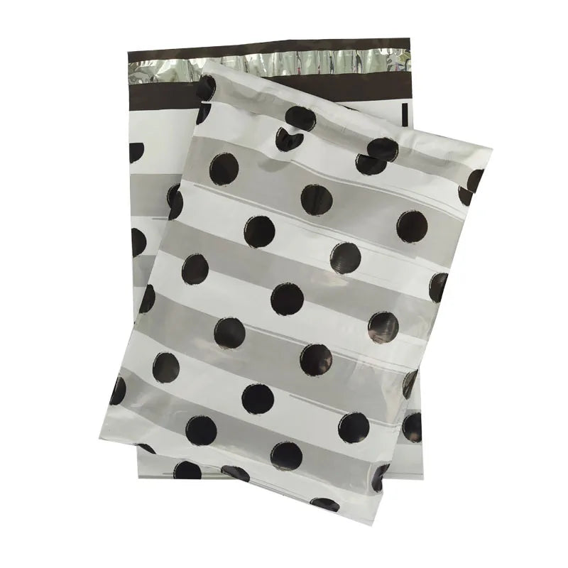 White poly mailer bags with black dot pattern and top tape seal
