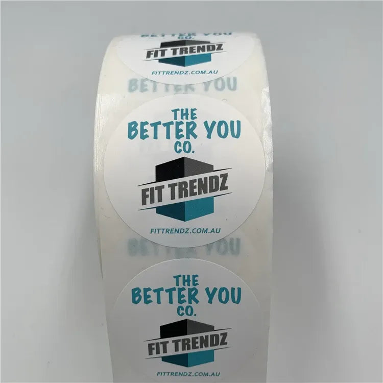 Front view of white custom printed label stickers roll with blue slogan text