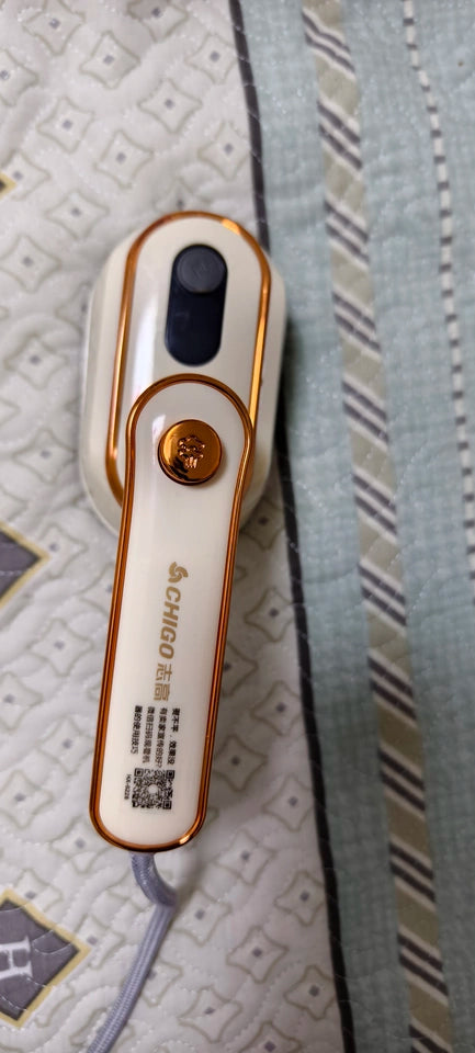 Tidesmit handheld portable steam iron showing dual wet and dry ironing feature for efficient garment care