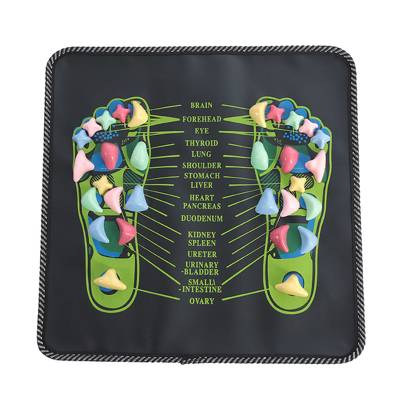 Black acupressure foot reflexology massage pad with colorful pressure stones and organ zone labels for home health.
