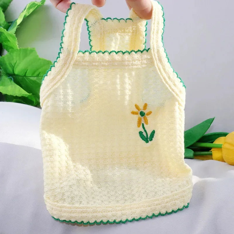 Soft yellow floral dog tank top for small pets. Breathable, lightweight summer clothes for Bichons and cats.