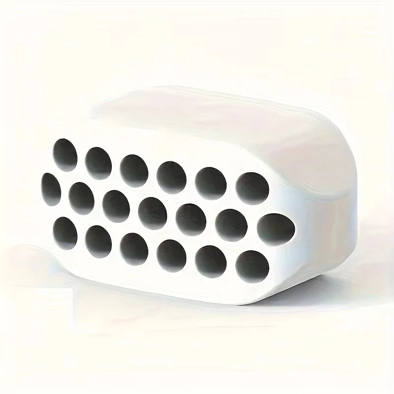 White, rectangular silicone jawline trainer featuring a grid of circular holes on a smooth, rounded surface.