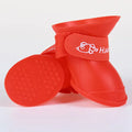 Red waterproof non-slip dog rain boots with secure straps for comfortable, safe outdoor pet walking.