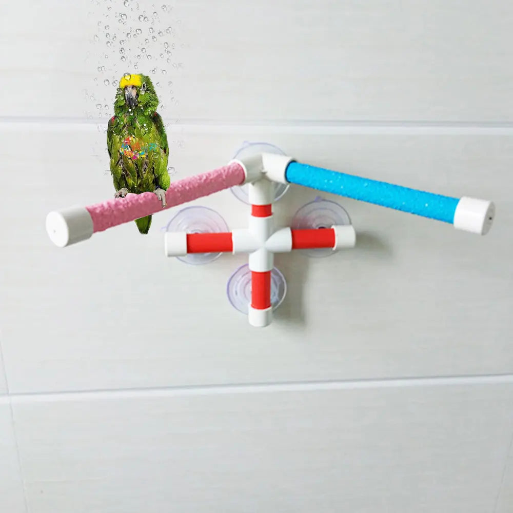 Parrot shower perch with suction cups and colorful paw-grinding bars for safe, easy bird bathing on bathroom tiles.