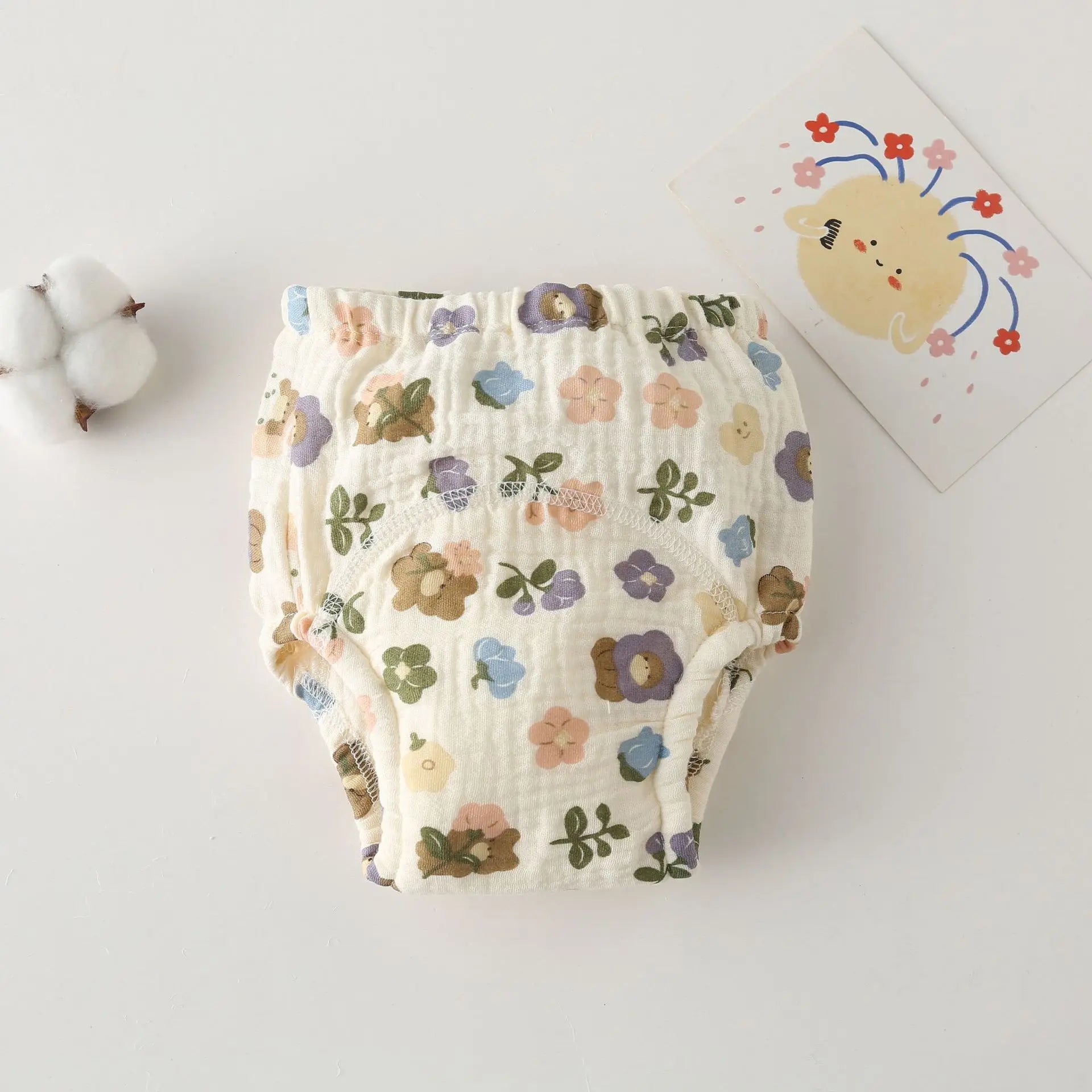 Floral cotton baby training diaper with soft muslin fabric for comfortable baby care.