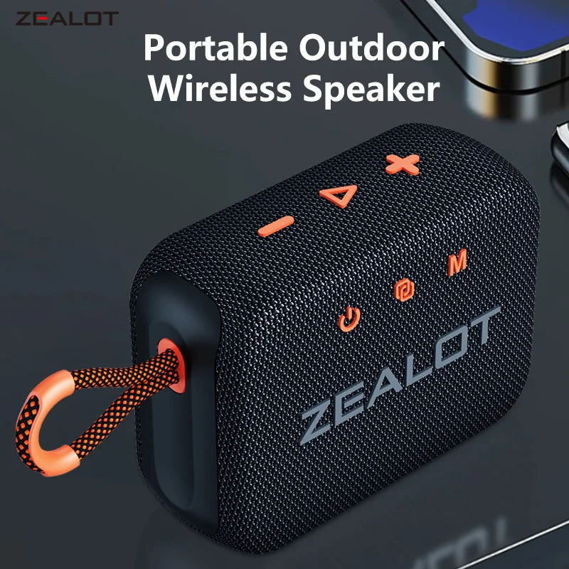 Black portable wireless outdoor speaker with orange handle and textured fabric body