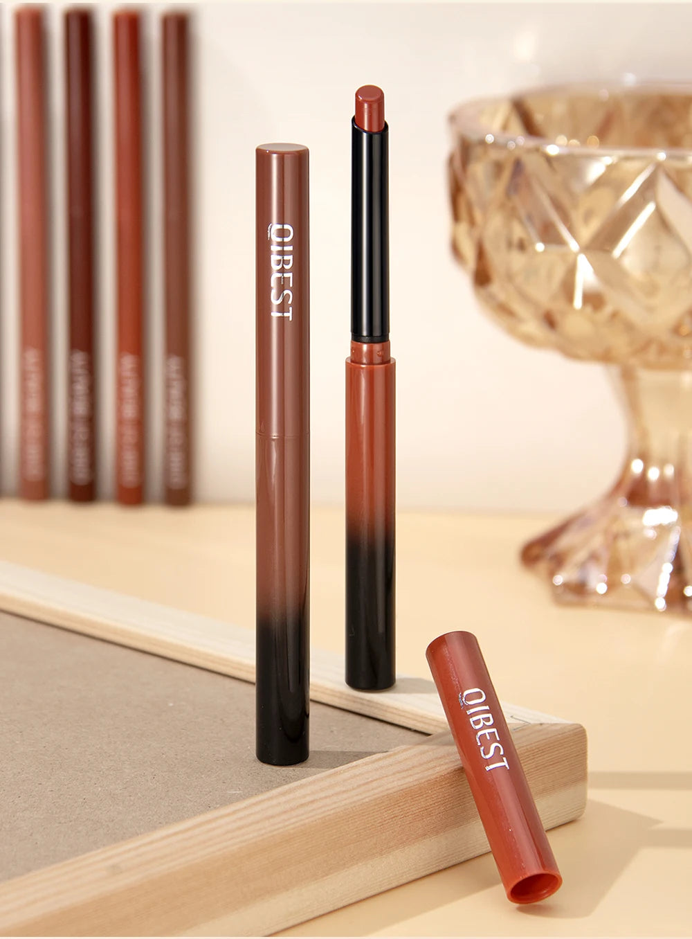 QIBEST 2pcs matte nude lipstick and lip liner set with waterproof, long-lasting brown pigment in gradient casing.