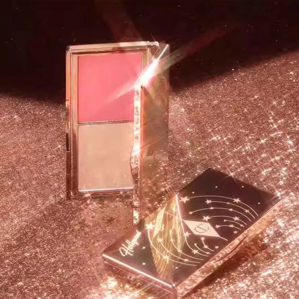 Charlotte Tilbury powder blush and highlighter duo in a gold celestial compact with soft pink pressed powder.