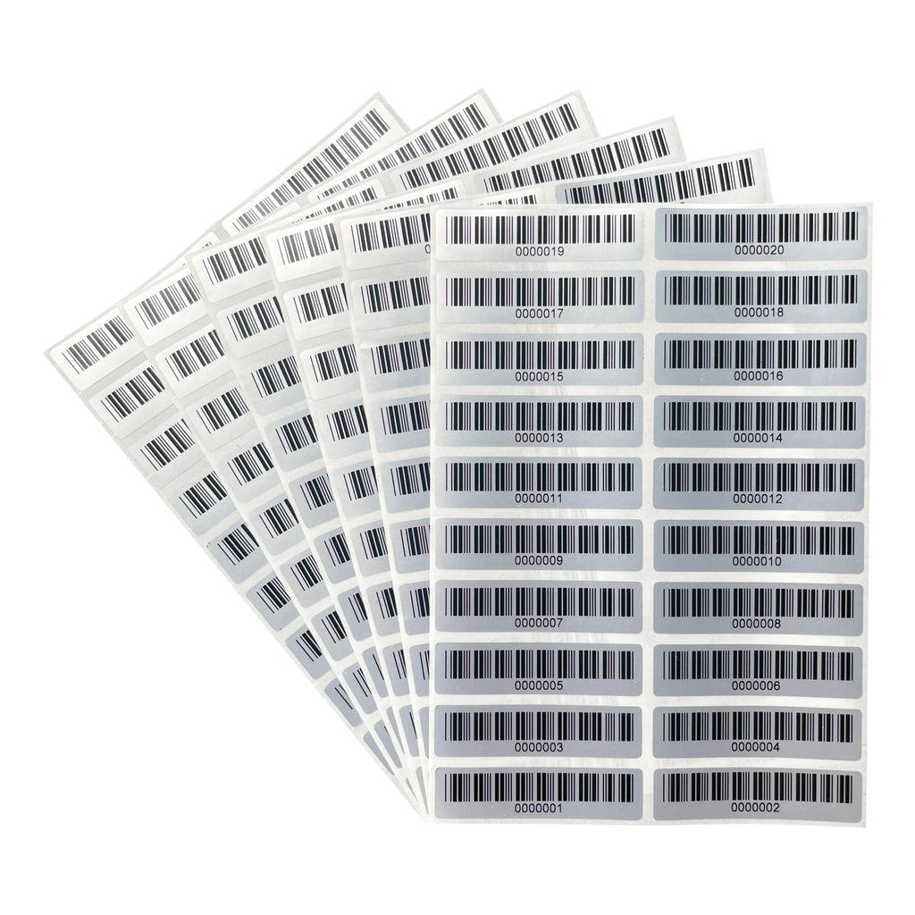 Matte silver PET barcode asset labels sheet, multiple rectangular labels fanned in a stack