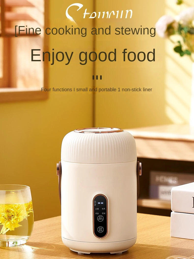 White portable electric stewing cup slow cooker standing on countertop