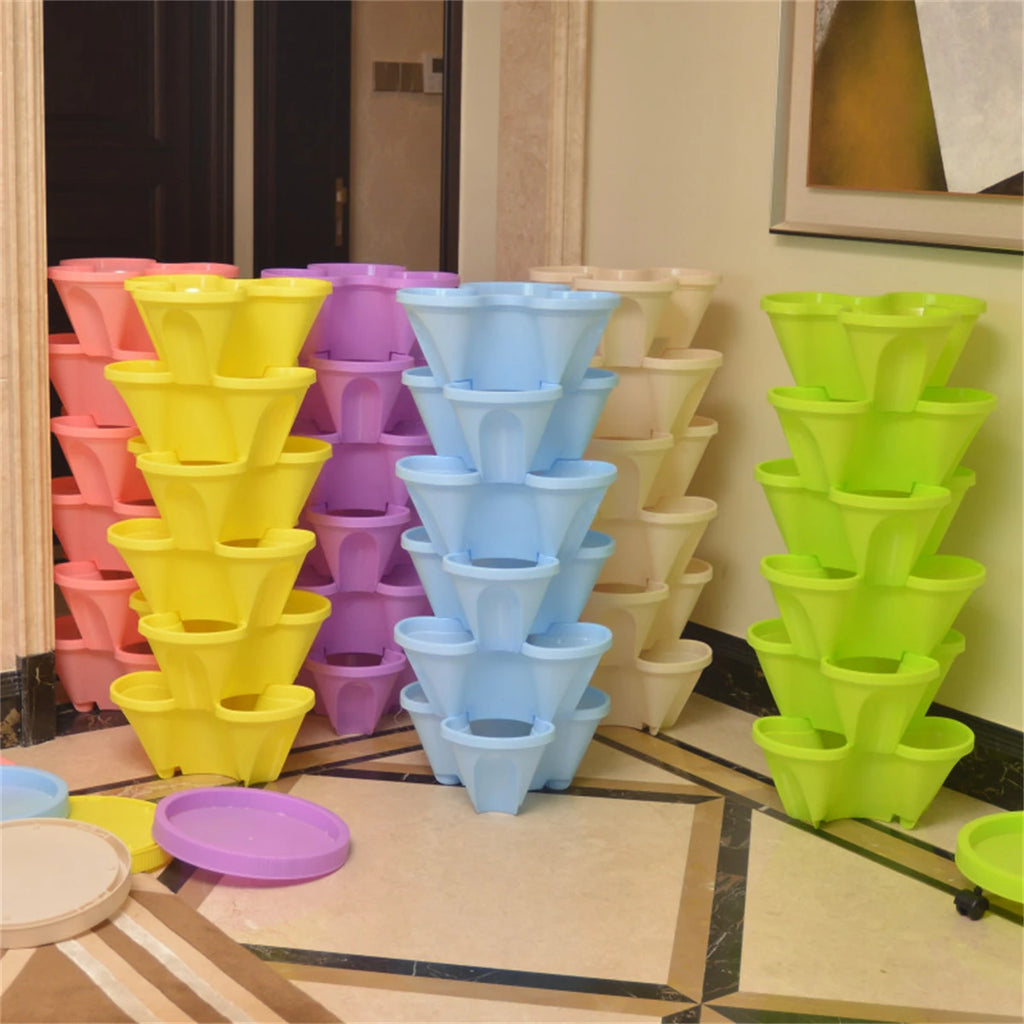 Set of stackable vertical planter pots in assorted colors with rolling base
