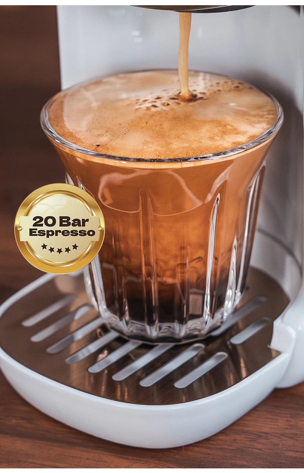 White 20 bar espresso machine pouring coffee into a glass cup with a gold badge feature.