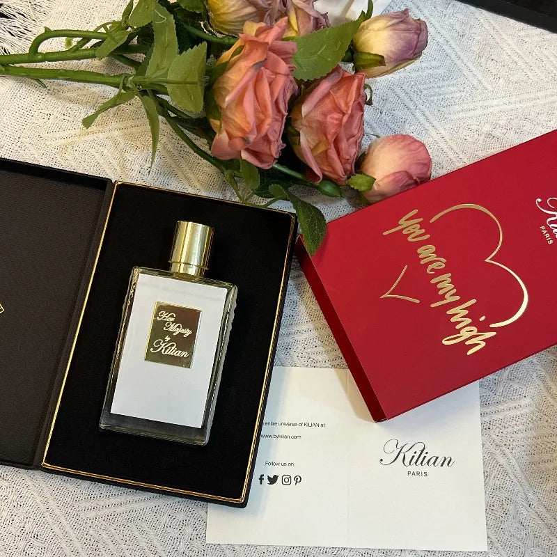 Kilian Her Majesty unisex perfume: 50ml floral chypre with peach, rum, rose, cedar. Elegant rectangular bottle design.