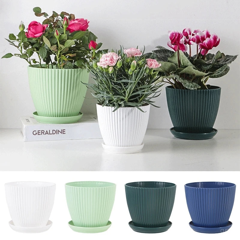 Ribbed plastic plant pots set with trays in white, mint, dark teal, and blue colors