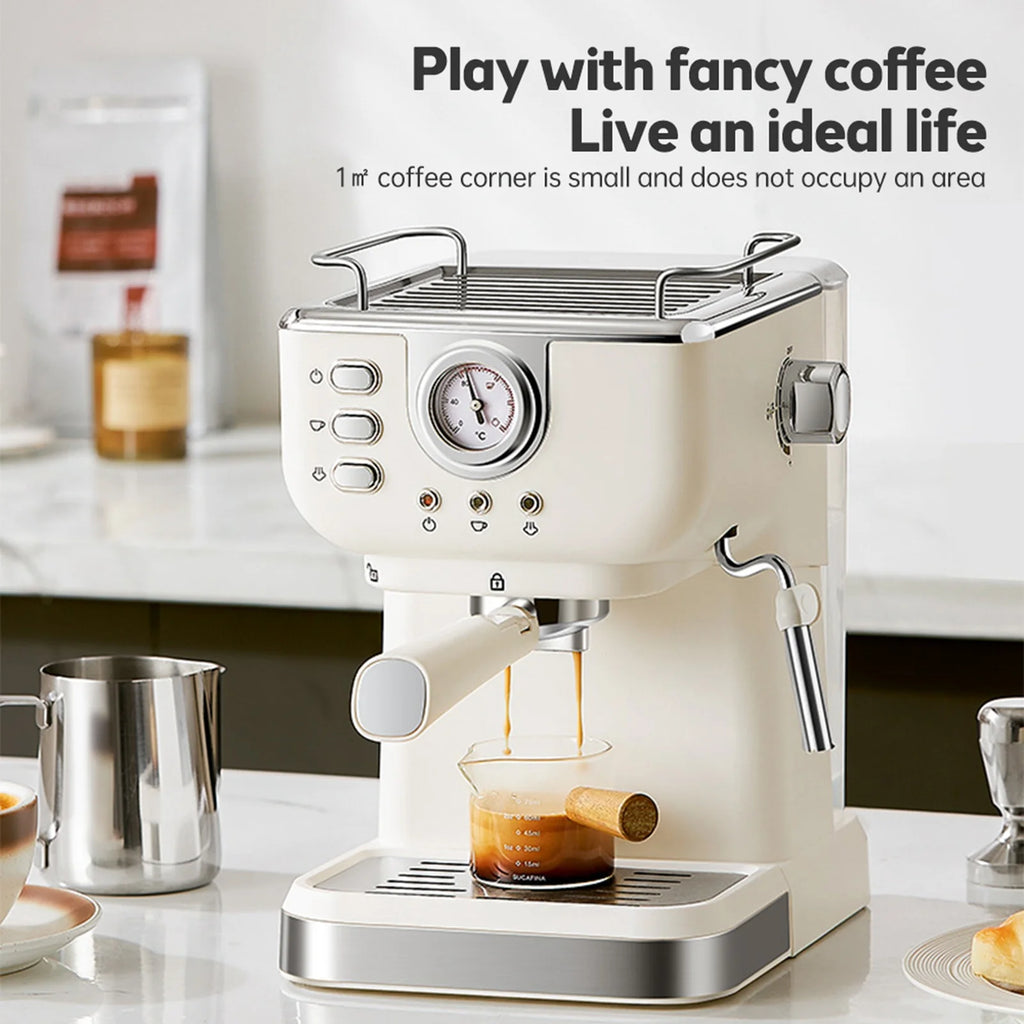 Cream-colored compact espresso machine with built-in pressure gauge and chrome accents brewing coffee.