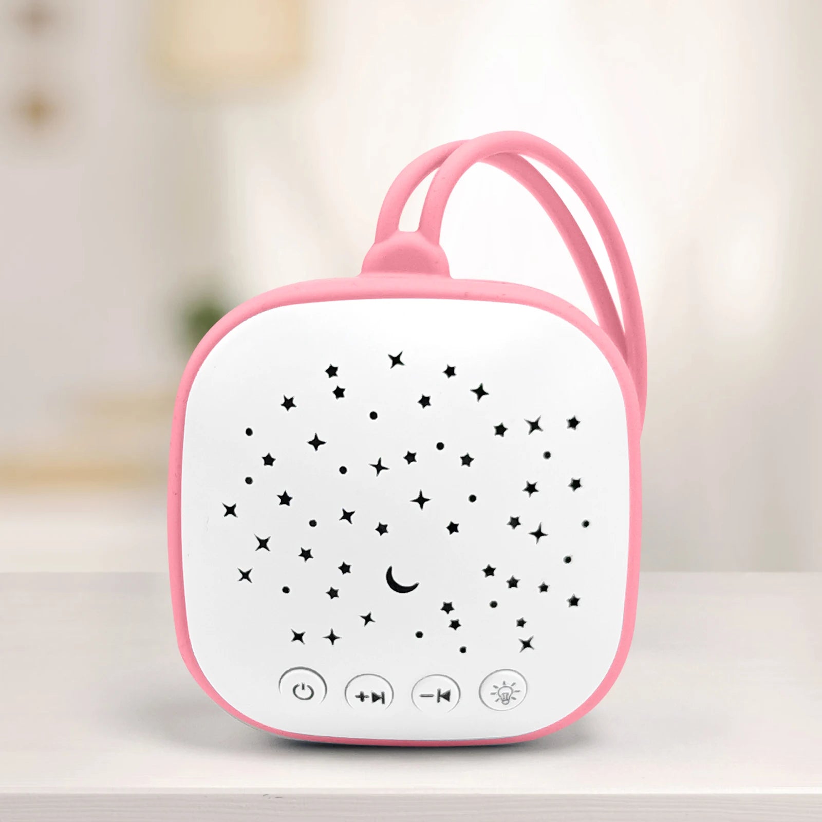 Pink and white sleep aid sound machine with star display and power, volume, and light control buttons for better sleep.