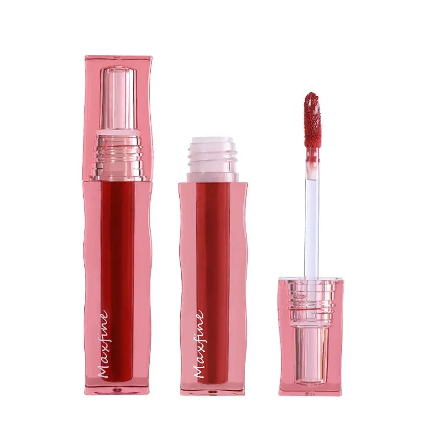 Maxfine waterproof liquid lipstick in a pink tube with a highly pigmented red lip glaze and applicator wand.