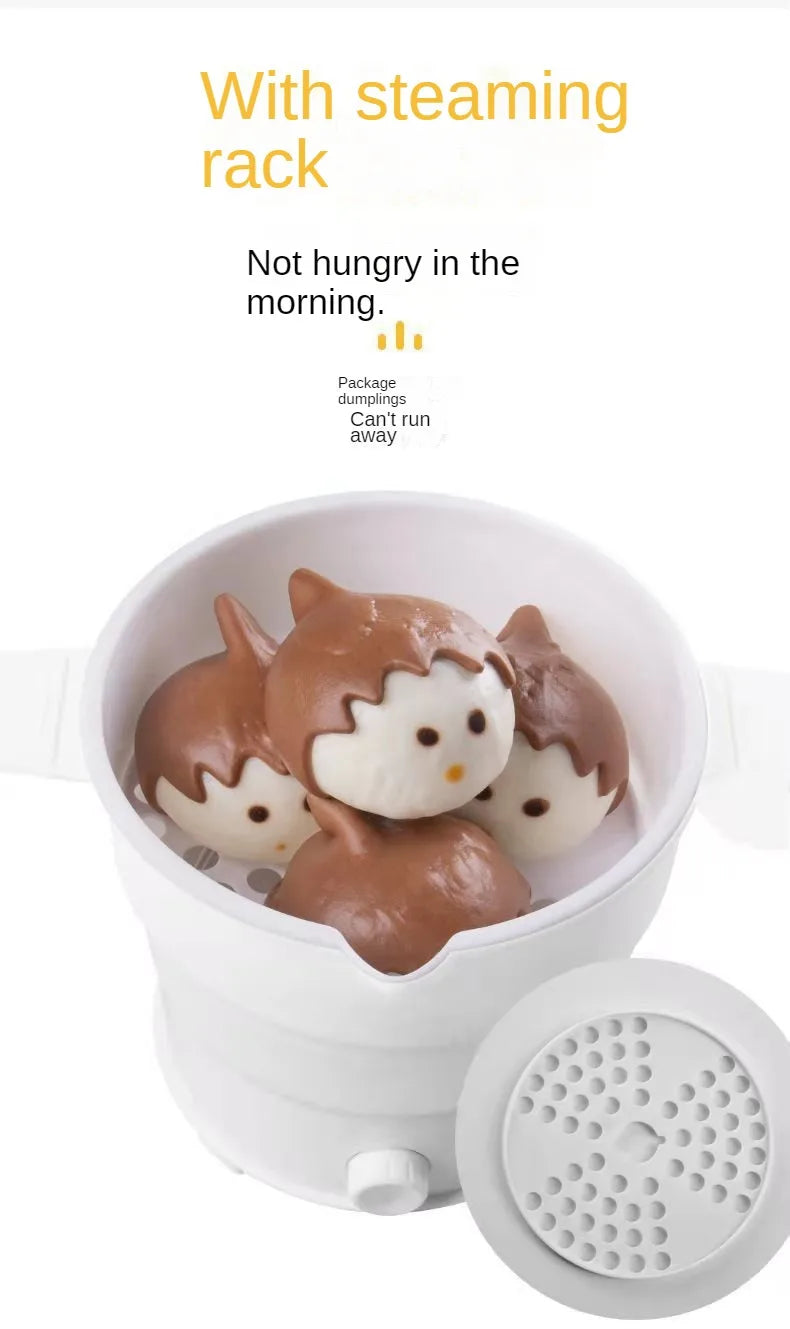 White foldable electric baby food warmer pot with steaming rack and food inside